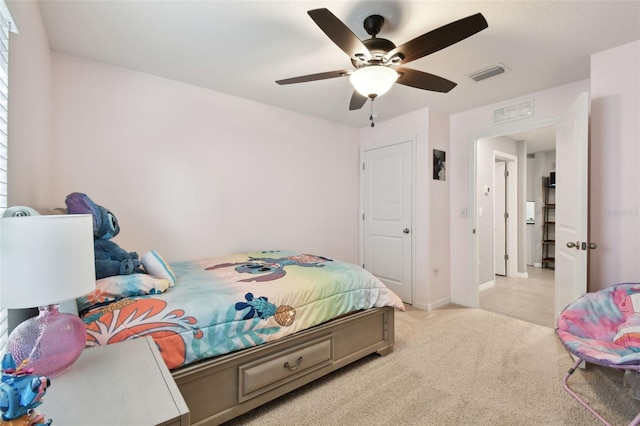 carpeted bedroom with ceiling fan