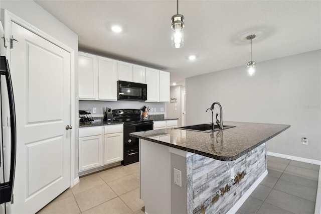 kitchen featuring sink, pendant lighting, a center island with sink, white cabinets, and black appliances