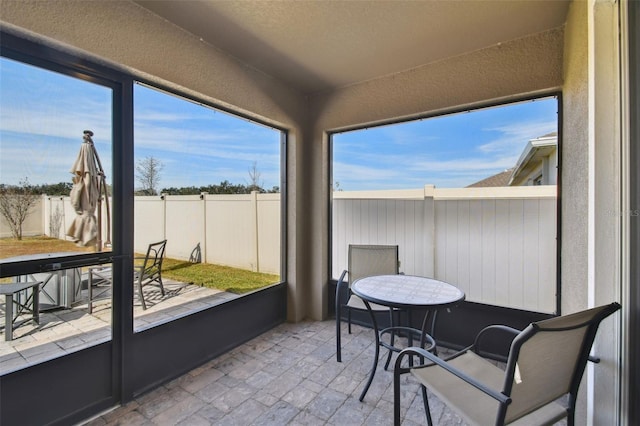 sunroom / solarium featuring plenty of natural light