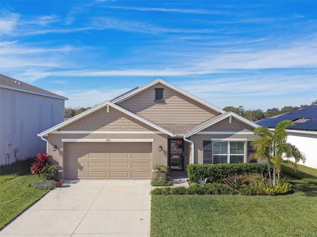 view of front of house with a garage and a front lawn