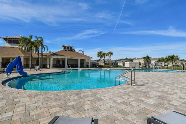 view of swimming pool with a patio area