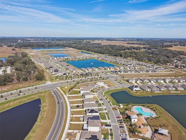 birds eye view of property with a water view