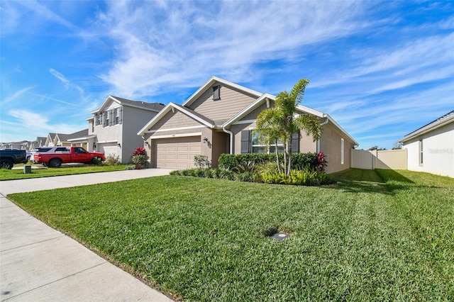 view of front of property with a garage and a front yard