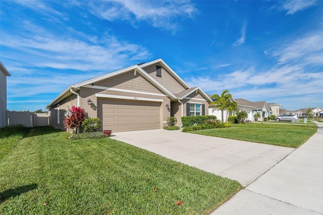 view of front of property with a garage and a front lawn