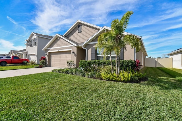 view of front facade with a garage and a front lawn