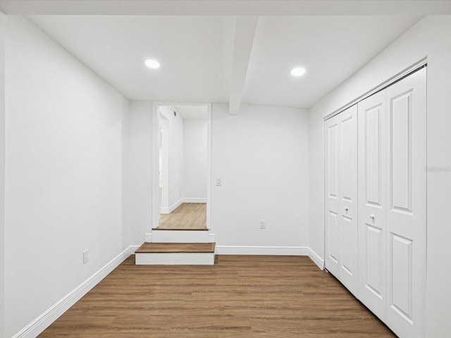 basement featuring hardwood / wood-style floors