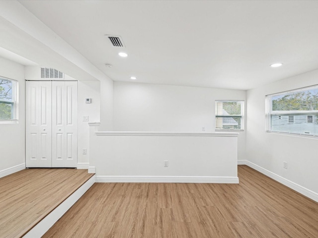 unfurnished room featuring light hardwood / wood-style floors