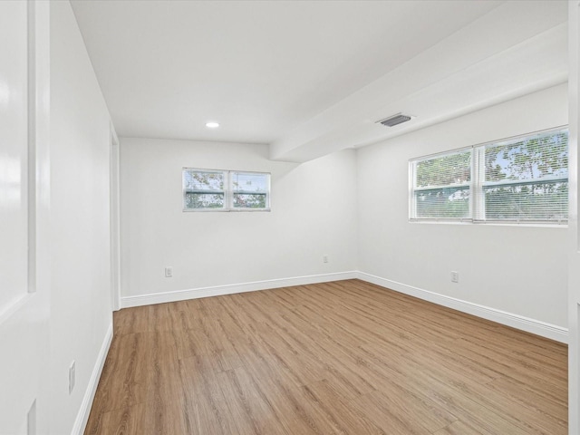 unfurnished room featuring light hardwood / wood-style flooring