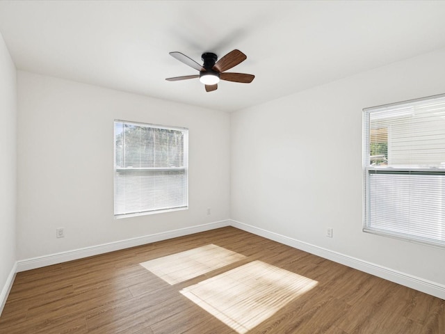 spare room featuring hardwood / wood-style flooring and ceiling fan