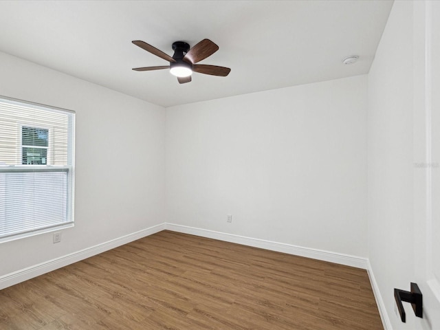 unfurnished room with hardwood / wood-style flooring and ceiling fan