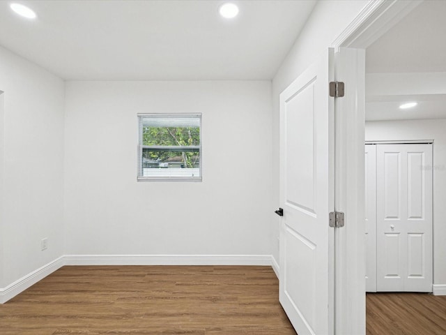 spare room featuring hardwood / wood-style floors