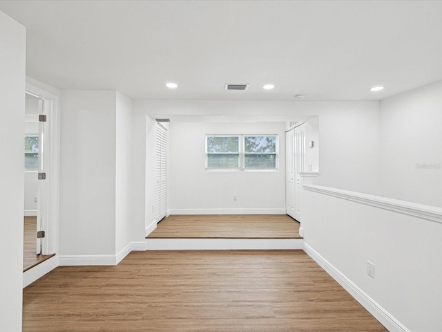 spare room featuring light wood-type flooring