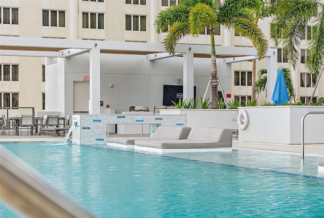 view of swimming pool with a patio area