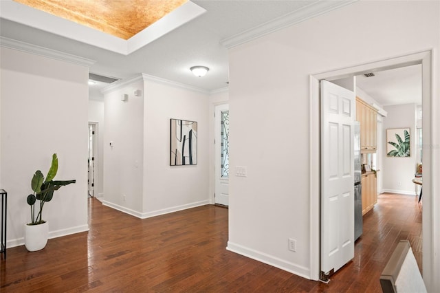 hallway with dark hardwood / wood-style flooring and crown molding