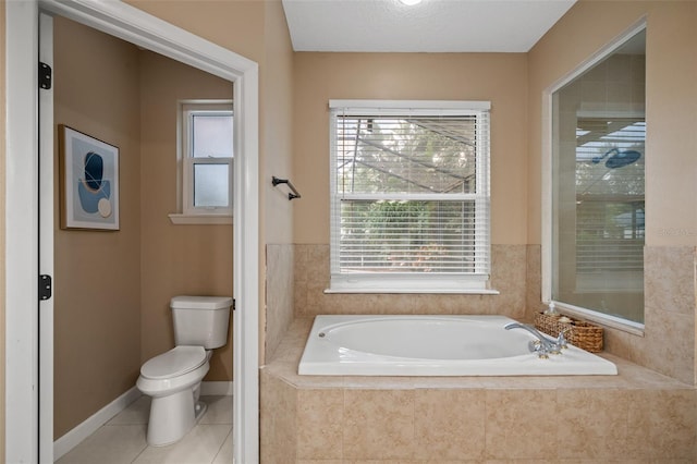 bathroom with tile patterned flooring, plus walk in shower, toilet, and a healthy amount of sunlight