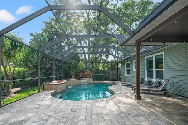 view of swimming pool featuring a lanai and a patio area