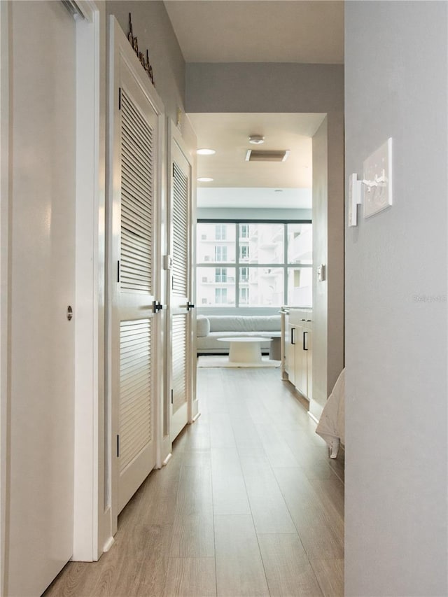 hallway featuring light wood-type flooring