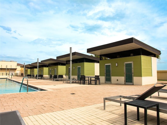 view of pool featuring a patio area