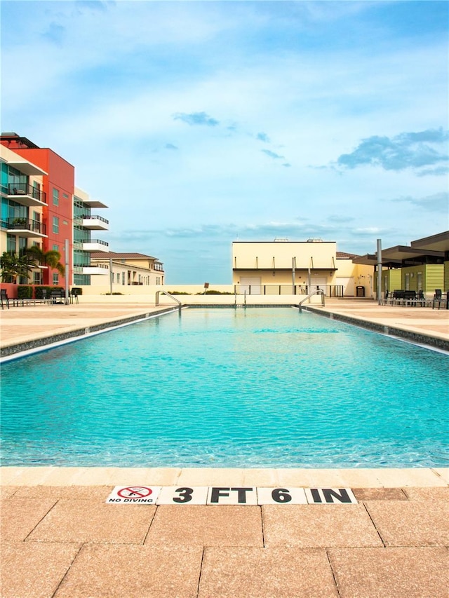 community pool featuring a patio area