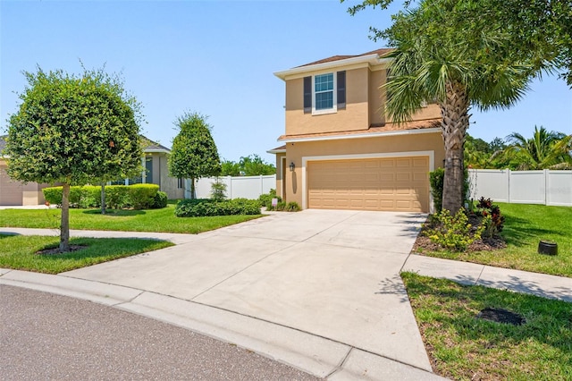 view of front of home with a front lawn and a garage