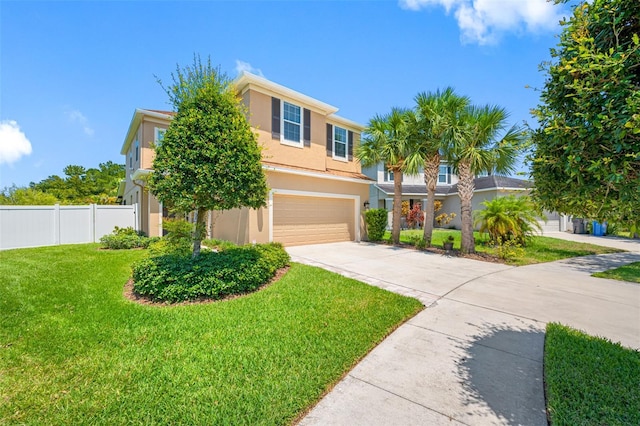 view of front of house featuring a garage and a front lawn