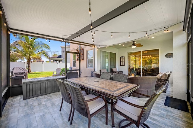 sunroom / solarium with ceiling fan