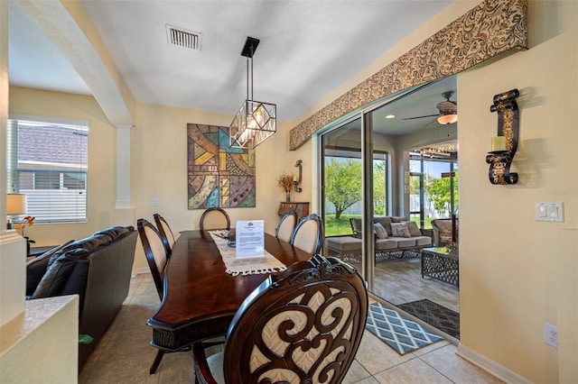 tiled dining room featuring ceiling fan