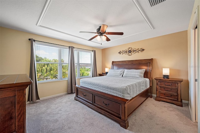 bedroom featuring ceiling fan and light carpet