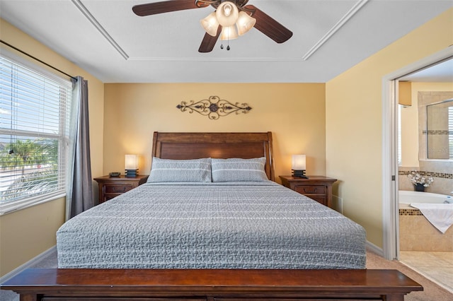 bedroom with connected bathroom, ceiling fan, and carpet floors