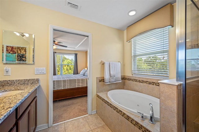 bathroom featuring plus walk in shower, vanity, tile patterned floors, and ceiling fan