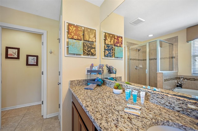 bathroom featuring tile patterned flooring, vanity, and shower with separate bathtub