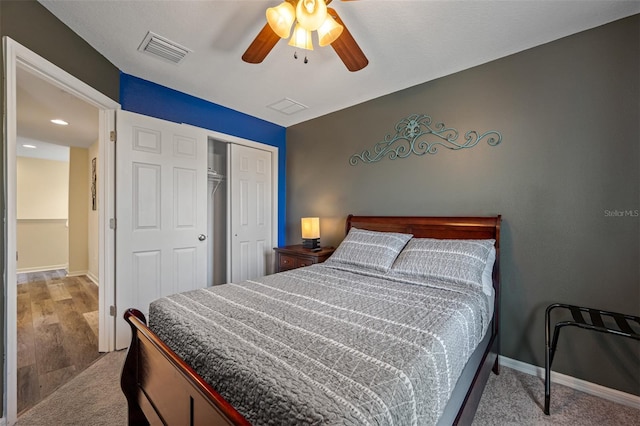 carpeted bedroom with a closet and ceiling fan