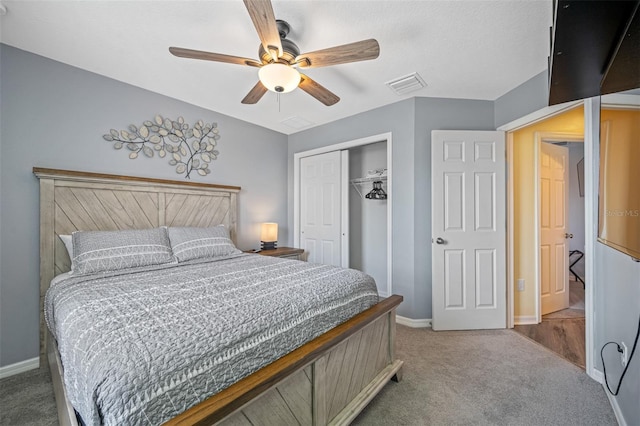 bedroom featuring ceiling fan, a closet, and carpet