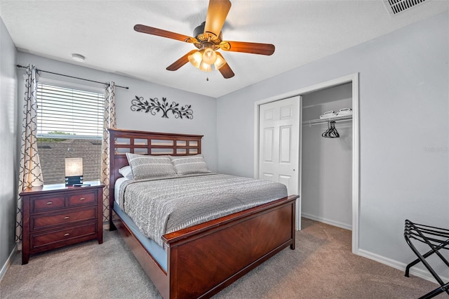 carpeted bedroom with a closet and ceiling fan