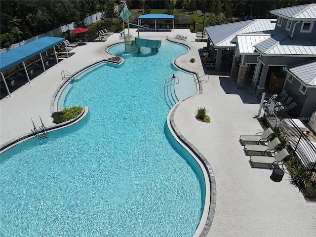 view of swimming pool featuring a patio area