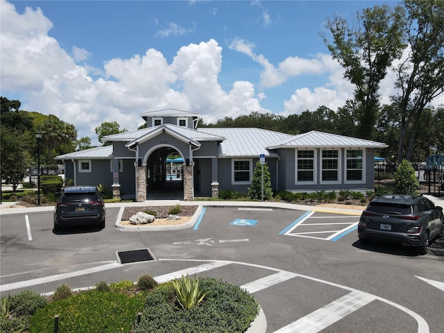 view of building exterior featuring uncovered parking