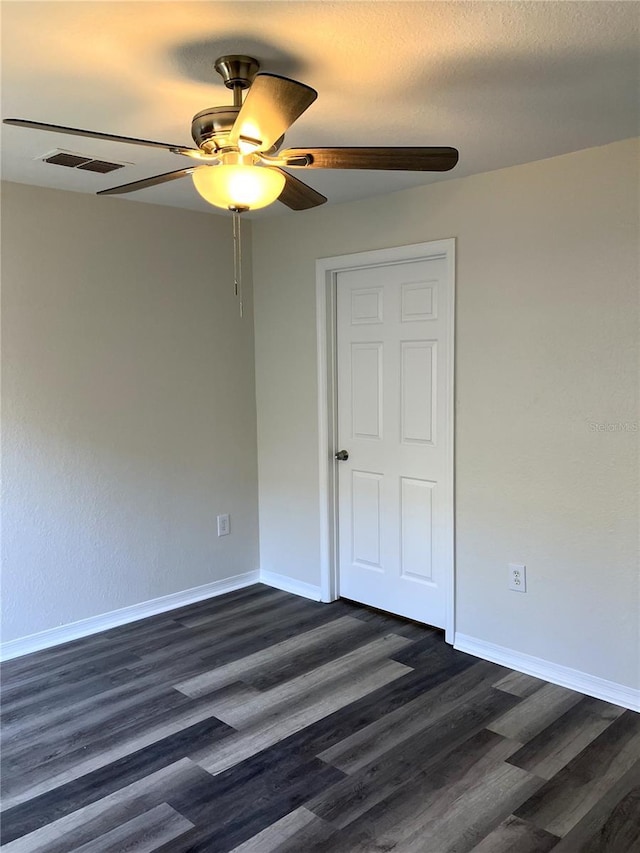 unfurnished bedroom featuring ceiling fan, dark hardwood / wood-style floors, and a textured ceiling