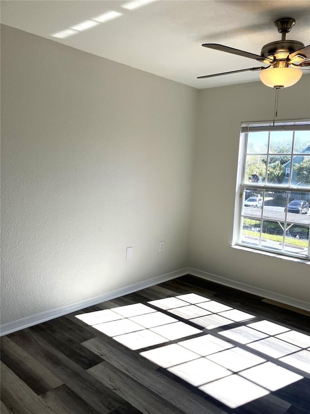 unfurnished room featuring ceiling fan and hardwood / wood-style flooring