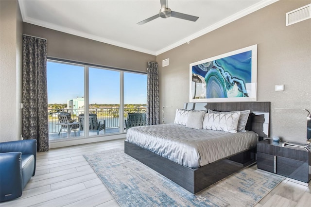 bedroom with ornamental molding, access to outside, ceiling fan, a water view, and light wood-type flooring