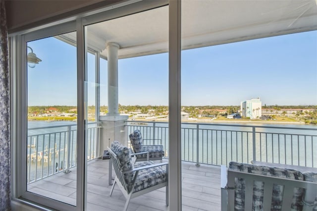 balcony featuring a water view