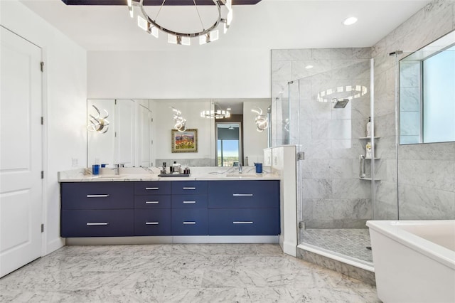 20001 Gulf Blvd Unit 501, Indian Shores, FL 33785 - bathroom featuring a chandelier, a stall shower, double vanity, marble finish flooring, and a soaking tub