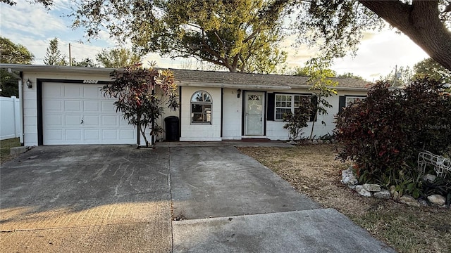 ranch-style home featuring a garage