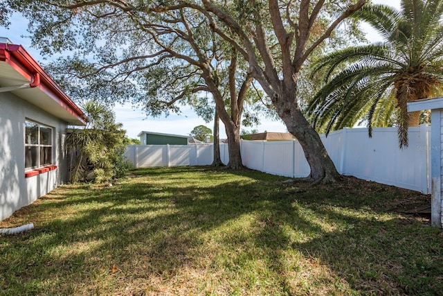 view of yard with a fenced backyard