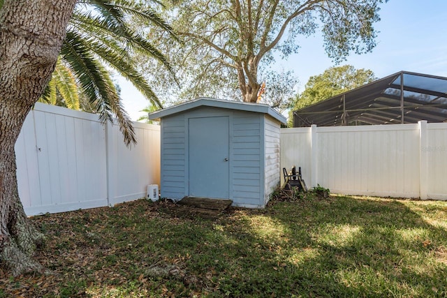 view of shed with a fenced backyard