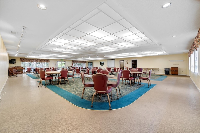 dining space featuring carpet