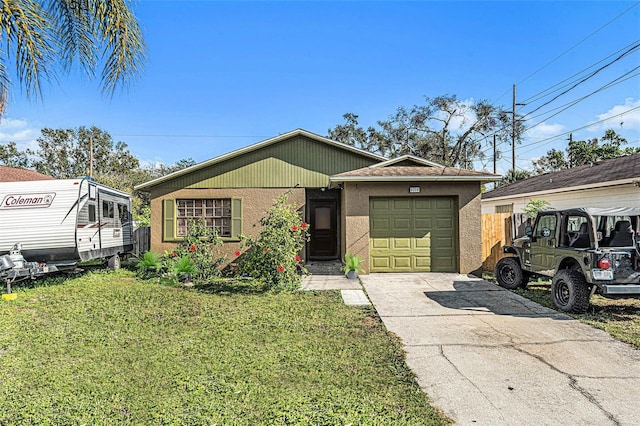 view of front of home with a garage and a front yard