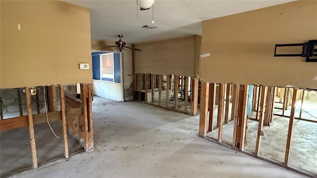 miscellaneous room with concrete floors and ceiling fan