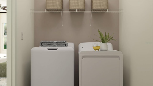 clothes washing area featuring separate washer and dryer