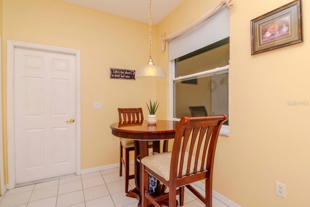 dining area featuring light tile patterned flooring