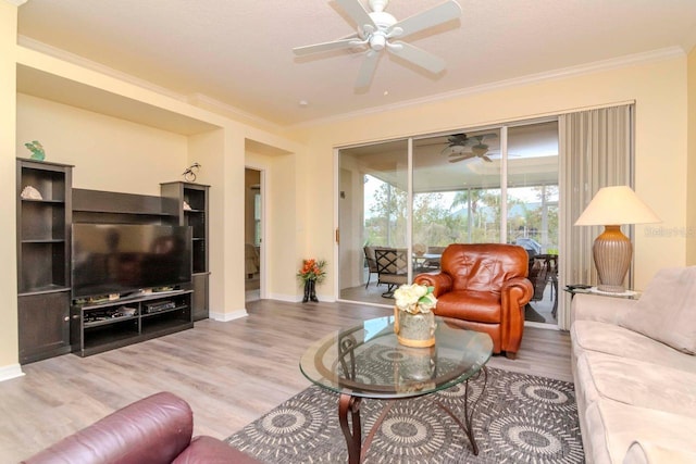 living room featuring light hardwood / wood-style floors and ornamental molding